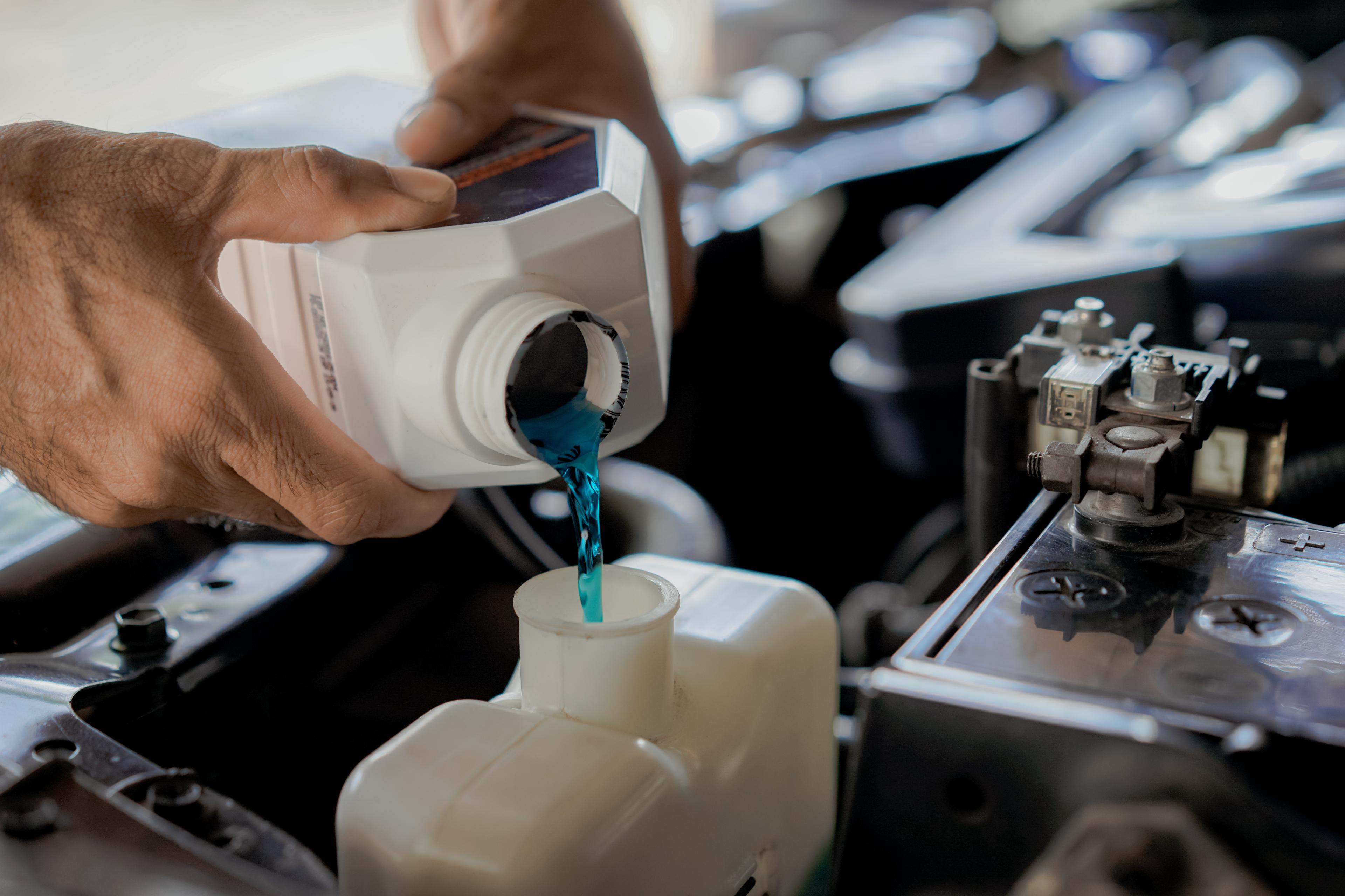Adding coolant to a car radiator