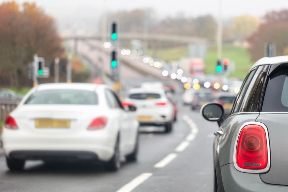 Cars driving on busy street