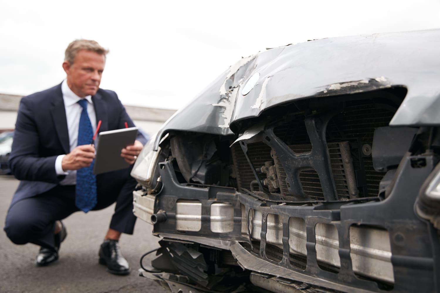 Man inspecting a car