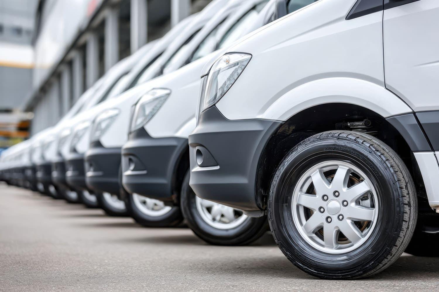 Vans for sale parked in a row