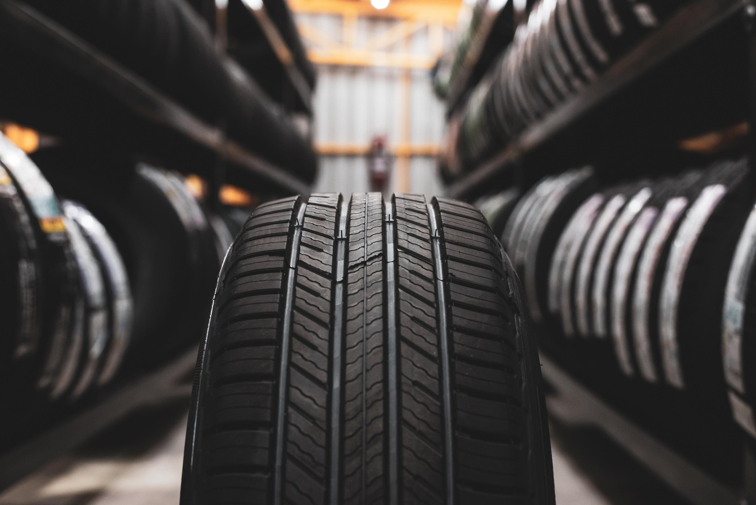 Tyre placed on the floor of a workshop