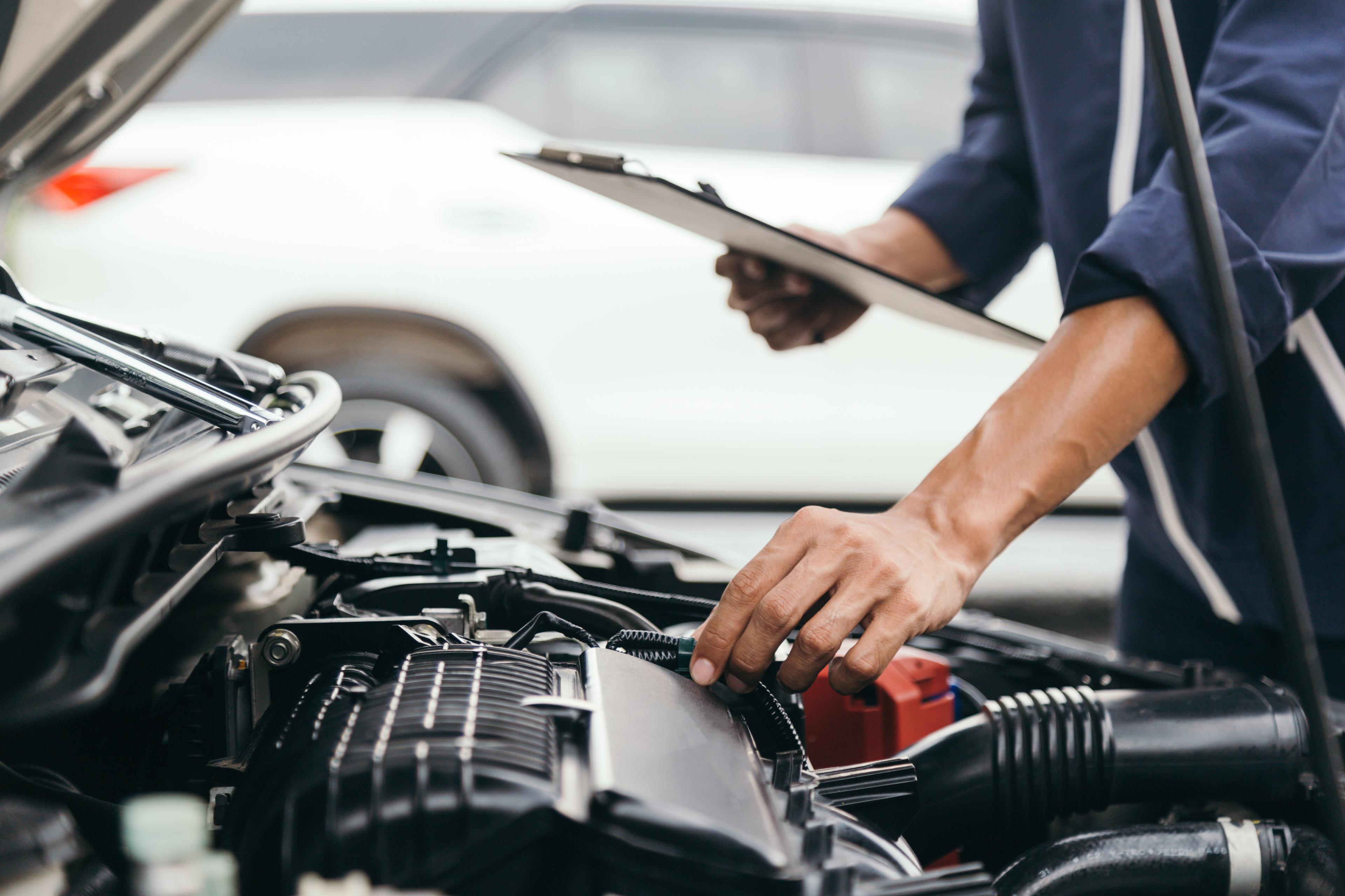 Mechanic inspects a car