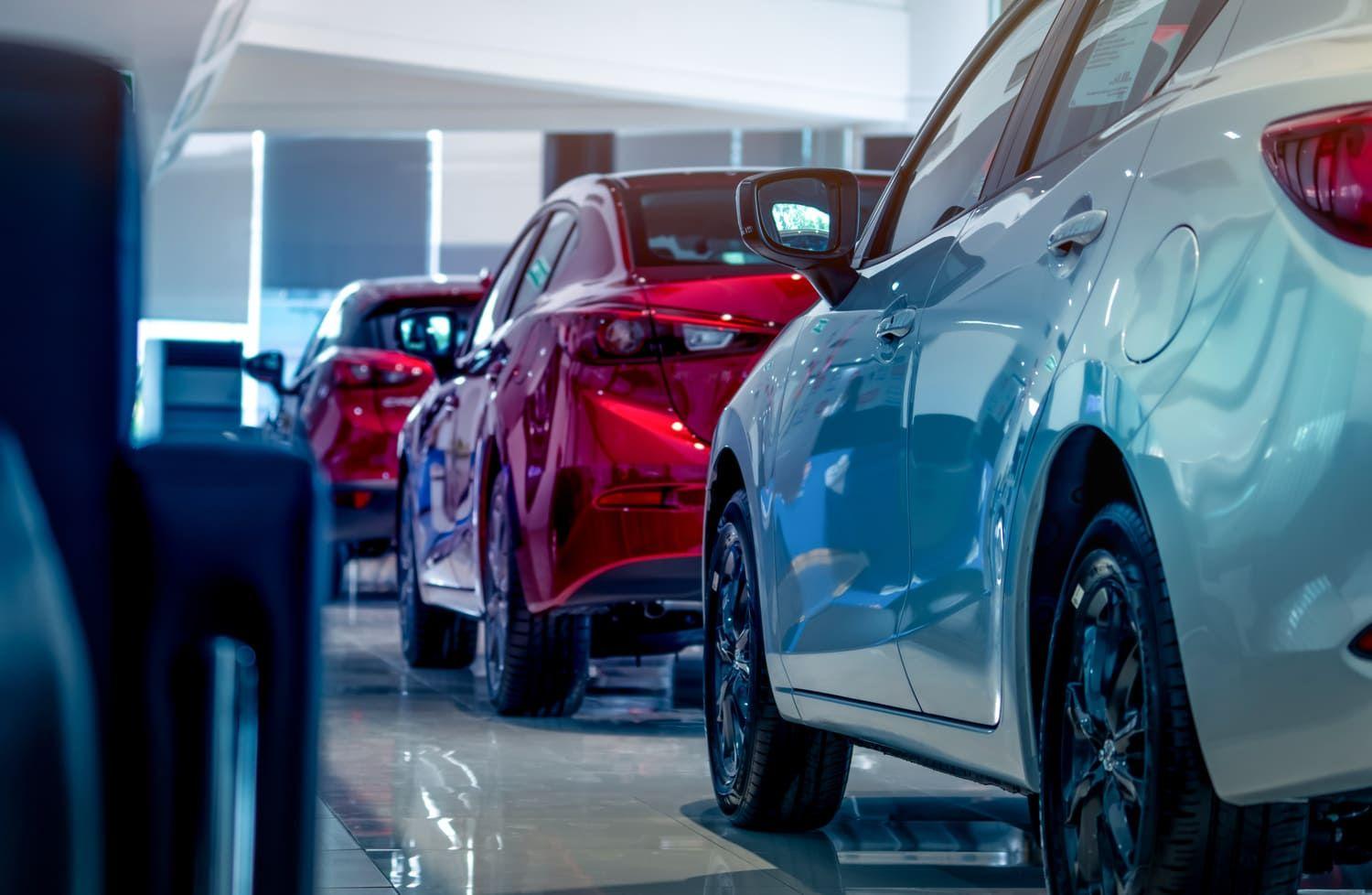 Cars parked in a line in a dealership