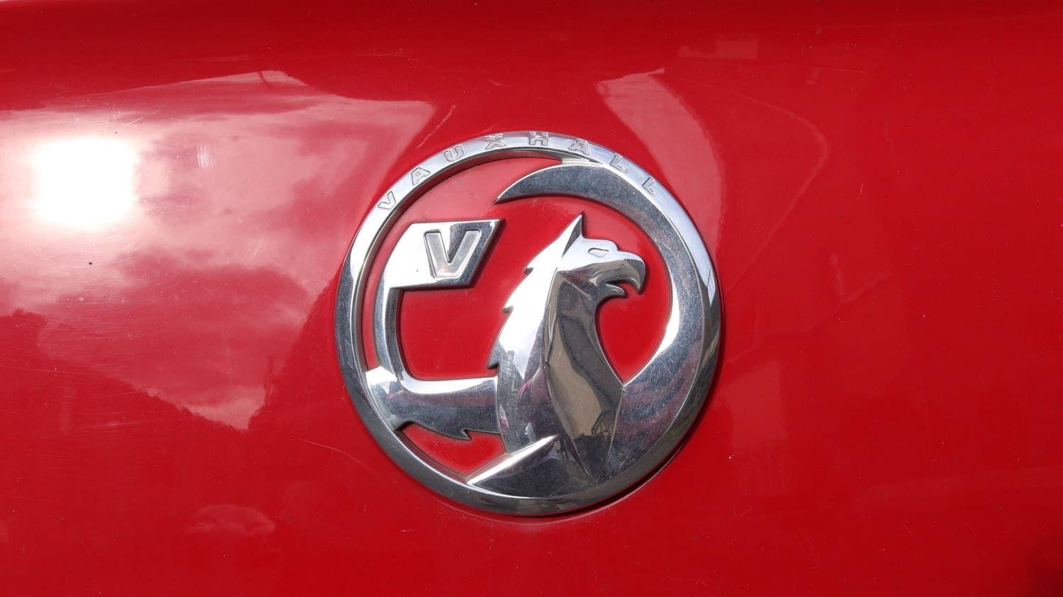 Close up of Vauxhall badge on a red car