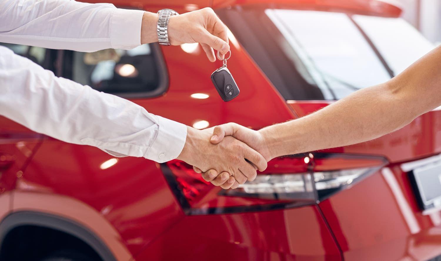 Handing over the keys after a car sale